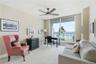 Versatile oceanfront room offers comfortable seating and flexible space for guests, a home office, or additional living area.
