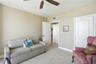 Bright and spacious oceanfront room featuring sliding glass doors, balcony access, and beautiful beach and ocean views.