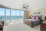 Oceanfront primary suite offers panoramic water views, abundant natural light, and plenty of room to relax.