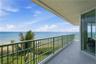 Enjoy panoramic ocean views and refreshing coastal breezes from this spacious private balcony.