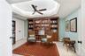 Versatile library featuring a built-in Murphy bed, custom wood cabinetry, and a beautiful tray ceiling. Perfect for accommodating overnight guests.