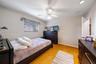 Wood-finish flooring, recessed lighting, and a ceiling fan with integrated light fixture