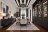 Virtually staged. Formal dining area featuring a tray ceiling with recessed lighting, custom floor-to-ceiling built-in cabinetry with glass-paneled di