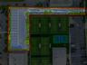 Aerial perspective featuring asphalt paved parking area with perimeter landscaping