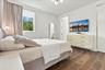 Wood-finish flooring, recessed lighting, polished metal hardware, and a modern multi-light chandelier fixture