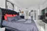 Polished stone flooring, recessed ceiling lighting, crown molding, and glass-paneled interior doors