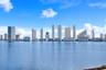 Expansive waterfront location featuring an unobstructed city skyline horizon
