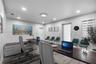 Room featuring wood-finish flooring, recessed lighting, and a custom built-in cabinetry unit