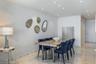 Interior space featuring polished stone flooring, textured wall covering, and recessed lighting throughout