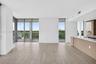 Minimalist interior featuring wood-finish flooring, recessed lighting, and a neutral color palette