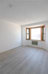 Bay window featuring wood-framed casement windows, wood-finish flooring, and recessed ceiling lighting