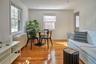 Living area featuring radiator heating unit and light wood-style floors