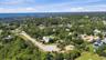 Privacy abounds with lushly landscaped grounds and a non-buildable privacy easement directly across the street