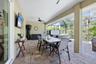 Covered lanai provides plenty of space for al fresco dining