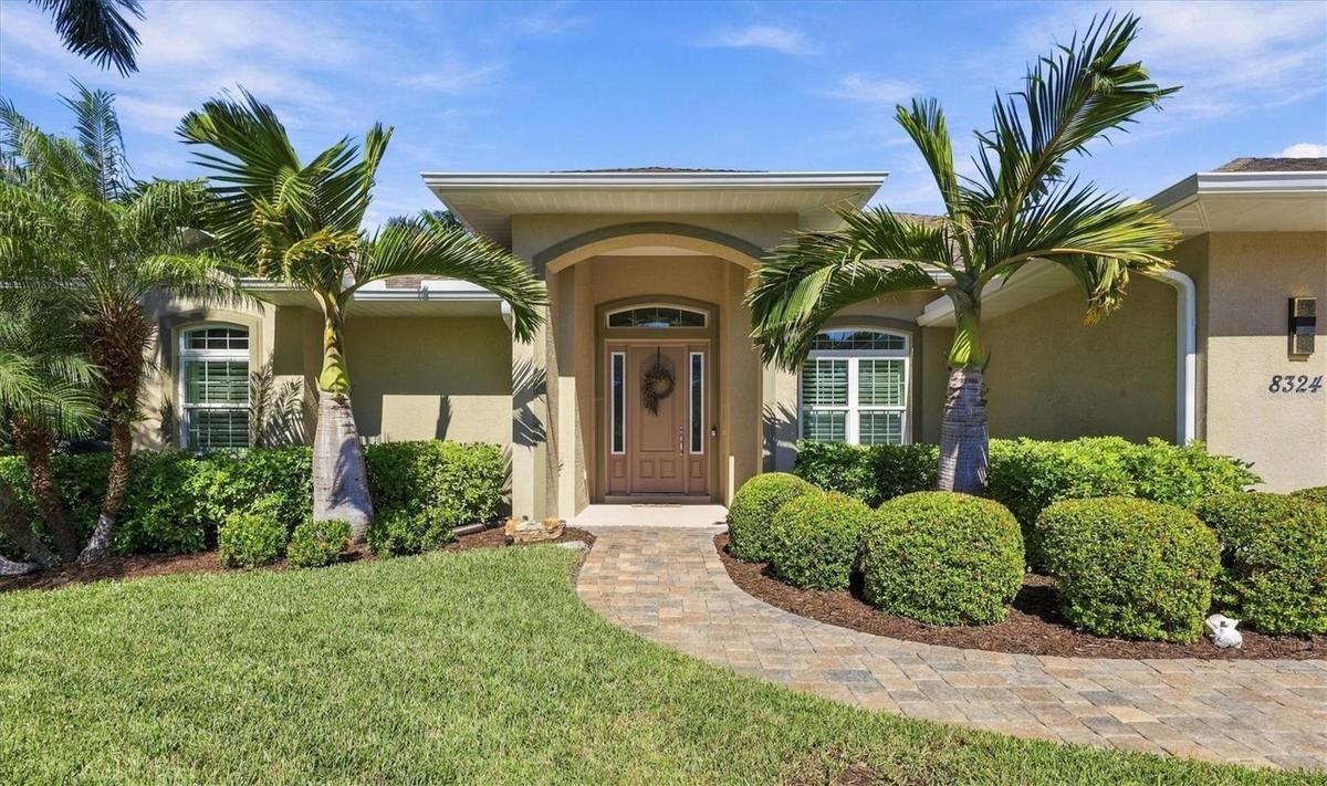 Beautiful paver driveway & walkway lead to the front entrance
