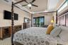Primary suite is just steps from the pool