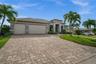 Paver driveway to the oversized 3 car garage
