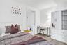 Room with wood-finish flooring and neutral wall tones