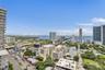 High-rise balcony featuring an elevated perspective of the surrounding cityscape and coastal waterway