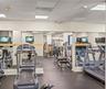 Fitness area featuring rubber flooring, expansive wall-to-wall mirrors, and recessed ceiling lighting