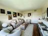 Living space featuring wood-finish flooring and double-panel closet doors