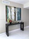 Glossy white tiled flooring and neutral wall paint