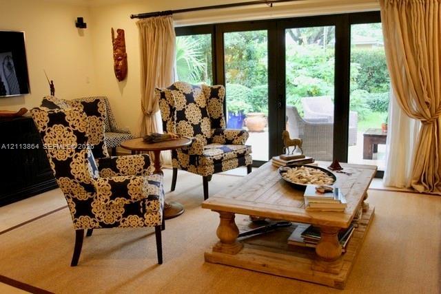 Black-framed multi-panel glass doors with patio access