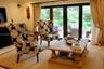 Black-framed multi-panel glass doors with patio access