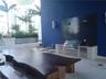 Outdoor kitchen featuring stainless steel built-in grill, cabinetry, and a dark tile backsplash