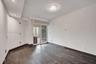 Room featuring wood-finish flooring, recessed lighting, a modern ceiling fixture, and a sliding glass door providing external access