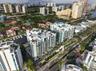 High-rise residential complex featuring glass-paneled balconies, multi-story structural design, dedicated marina slips, and extensive perimeter landsc