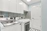 Laundry room with water heater closet & water sortner system
