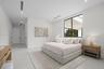 Spacious room featuring high ceilings, recessed lighting, expansive large-format windows with black frames, and smooth-finish flooring