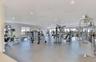 Expansive fitness center featuring recessed lighting, rubberized flooring, and numerous large windows