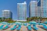 Beach club for residents, including chairs, towels, umbrellas, and food and beverage service