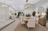 Vaulted ceilings, wood-finish flooring, recessed lighting, rectangular metal-frame pendant chandelier, and multi-panel sliding glass door
