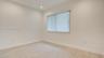 Neutral-toned interior featuring wood-finish flooring, recessed lighting, and vertical window blinds