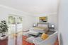 Interior space featuring wood-finish flooring, white crown molding, and glass-paneled double doors