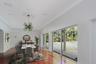 Spacious dining area featuring wood-finish flooring, a decorative ceiling medallion, recessed lighting, and expansive floor-to-ceiling sliding glass d