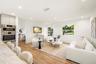 Open-concept interior featuring wood-finish flooring, recessed lighting, and a built-in stainless steel double wall oven
