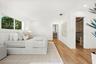 Interior space featuring wood-finish flooring, recessed lighting, and a walk-in closet with built-in shelving