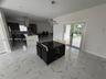 Polished stone-finish tile flooring, kitchen island with built-in cabinetry, stainless steel range hood, recessed lighting, and double glass pane door