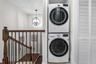 Dedicated laundry closet with stacked appliances