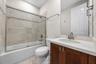 Updated Vanity, Glass Shower Door, Tiled Wall at Shower and vanity-to-ceiling mirror