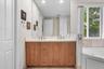 Dual vanity with oversized mirror