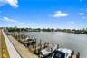 Waterfront property featuring a concrete bulkhead, deep-water dockage, and multiple boat slips
