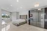 Room featuring polished stone flooring, recessed ceiling lighting, a flush-mount crystal-style light fixture, and floor-to-ceiling mirrored closet doo