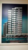 High-rise residential exterior featuring tiered structural balconies, a ground-level swimming pool, and striped retractable awnings