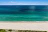 Direct waterfront access with sandy beach frontage and coastal vegetation