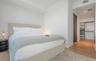Interior space featuring wood-finish flooring, recessed lighting, and a walk-in closet with built-in shelving